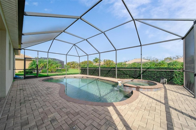 view of pool featuring a lanai, a patio area, and a pool with connected hot tub