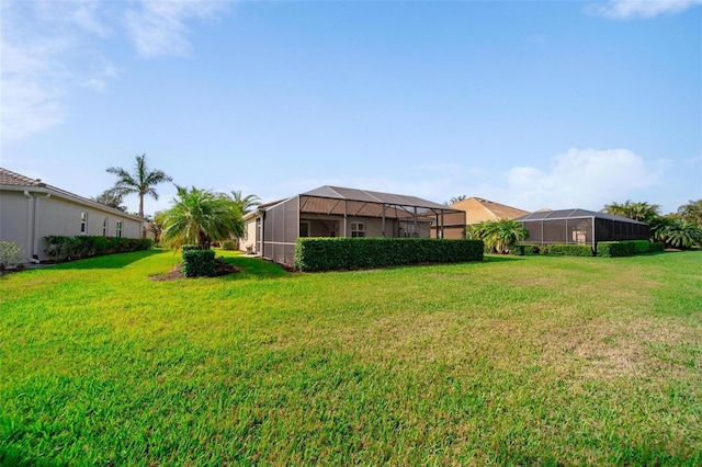 view of yard with a lanai