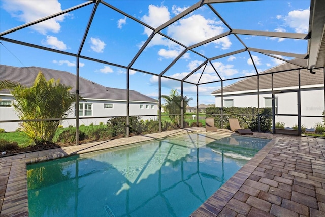 pool featuring a lanai and a patio area