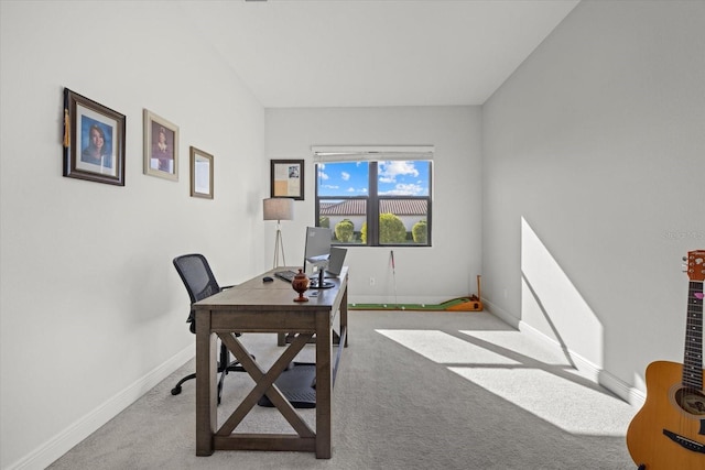 carpeted office featuring baseboards