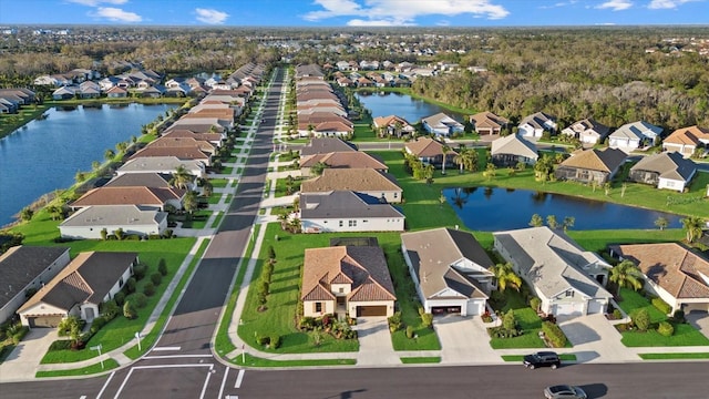 birds eye view of property featuring a residential view and a water view