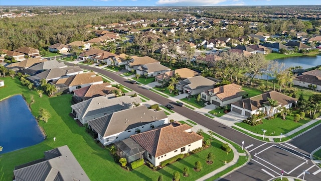 aerial view featuring a water view and a residential view