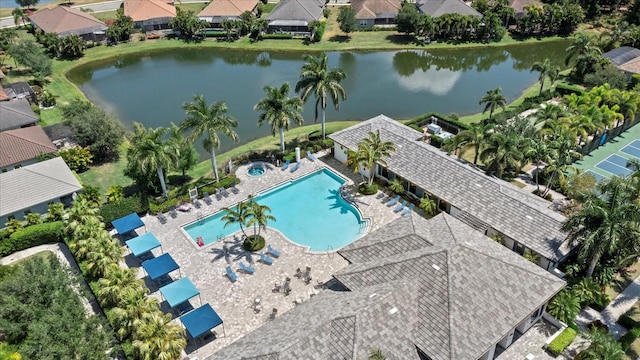 drone / aerial view with a residential view and a water view