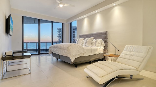 tiled bedroom featuring access to exterior, recessed lighting, ceiling fan, and expansive windows