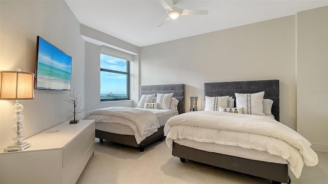 bedroom featuring ceiling fan and light tile patterned flooring