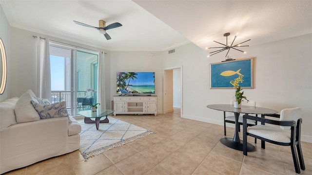 living area with visible vents, ornamental molding, ceiling fan with notable chandelier, light tile patterned flooring, and baseboards