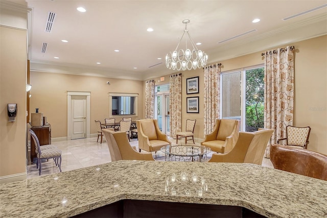 kitchen featuring visible vents, light stone countertops, an inviting chandelier, and ornamental molding