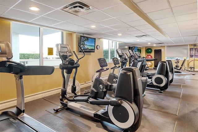 gym featuring visible vents, baseboards, and a drop ceiling