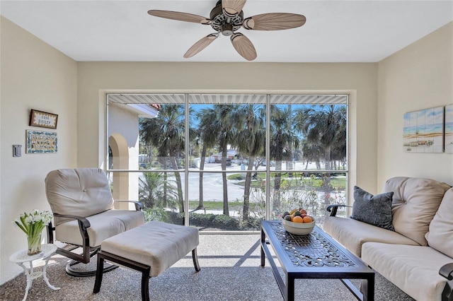 living area with ceiling fan