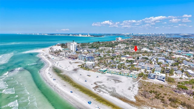 drone / aerial view featuring a water view and a beach view