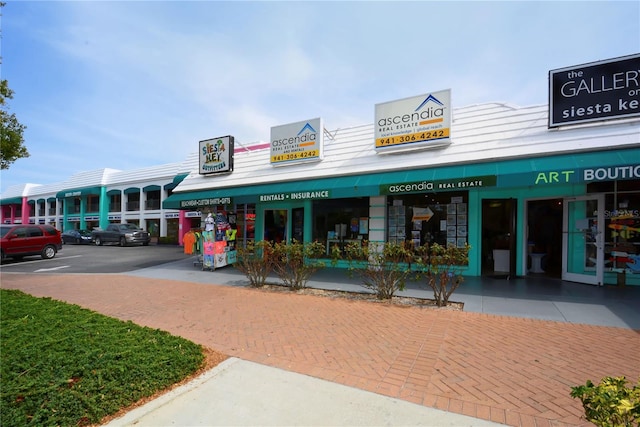 view of property featuring uncovered parking