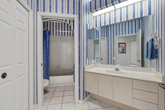 full bath featuring toilet, wallpapered walls, vanity, and tile patterned floors