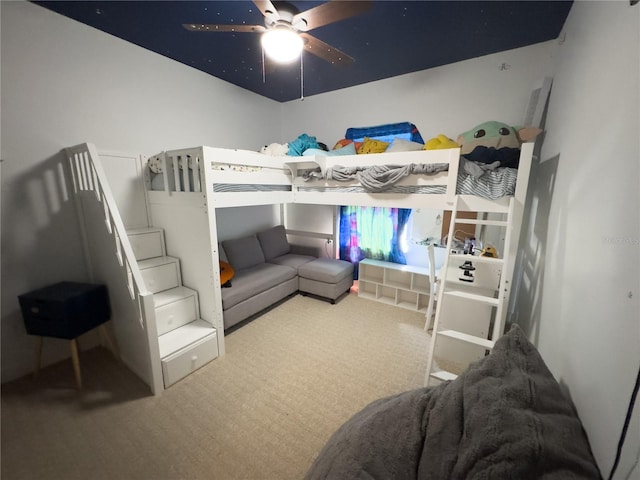 bedroom featuring ceiling fan and carpet flooring