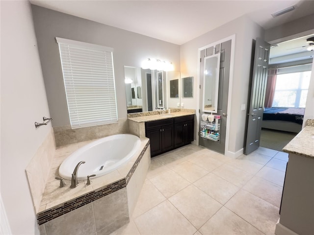 ensuite bathroom with visible vents, ensuite bathroom, vanity, tile patterned flooring, and a bath