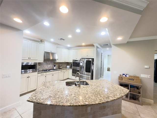 kitchen featuring stainless steel appliances, visible vents, light tile patterned flooring, a sink, and under cabinet range hood