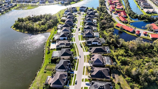 aerial view featuring a water view and a residential view