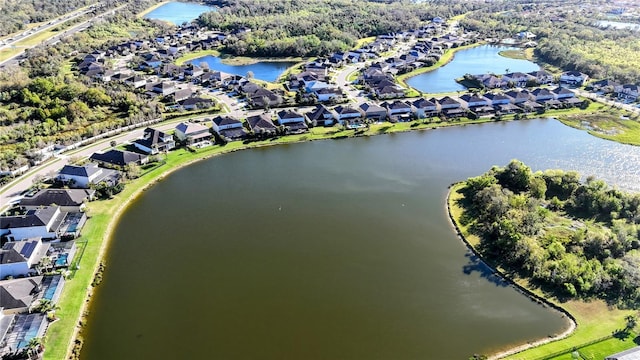 birds eye view of property with a water view and a residential view