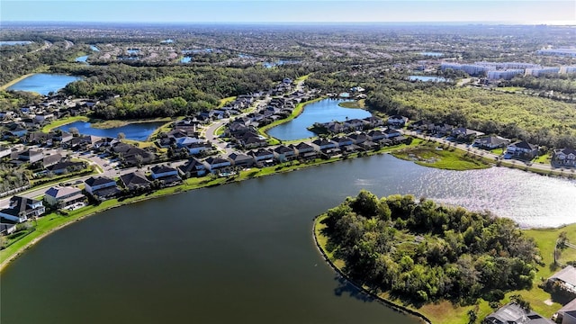 bird's eye view featuring a residential view and a water view