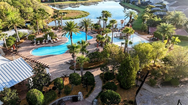 pool with a water view and a patio area