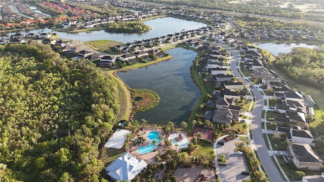 bird's eye view featuring a water view and a residential view