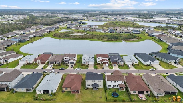 birds eye view of property with a residential view and a water view