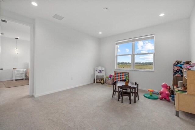 recreation room with carpet floors, recessed lighting, and baseboards