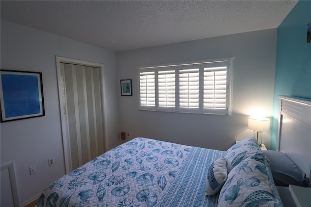 bedroom featuring a closet and a textured ceiling