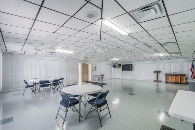 dining area with a paneled ceiling, visible vents, and tile patterned floors