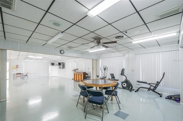 dining area featuring a ceiling fan, visible vents, and a drop ceiling