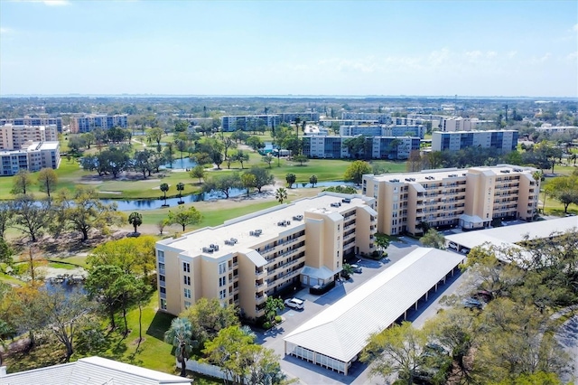 birds eye view of property with a city view and a water view