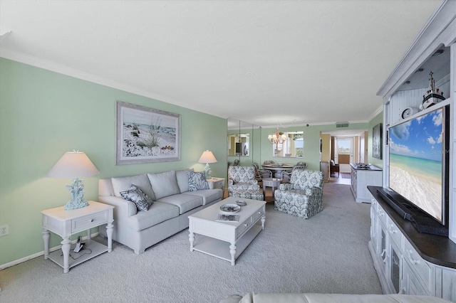 living area with visible vents, baseboards, ornamental molding, an inviting chandelier, and carpet floors