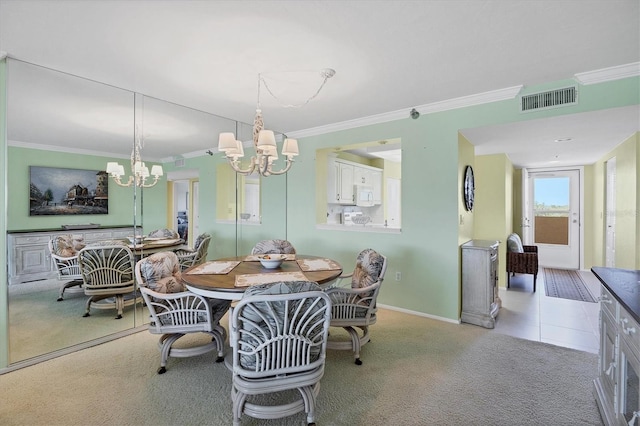 dining space featuring visible vents, crown molding, light carpet, and baseboards