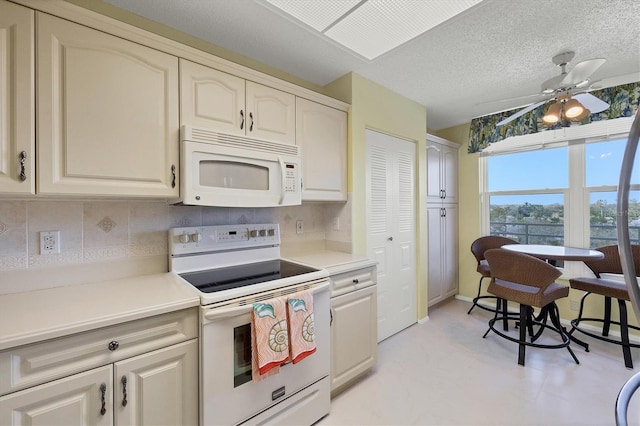 kitchen with white appliances, light countertops, ceiling fan, and decorative backsplash