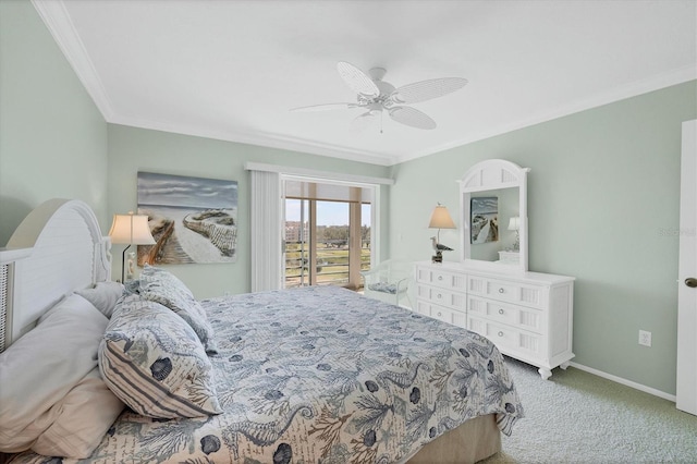 carpeted bedroom with a ceiling fan, crown molding, and baseboards