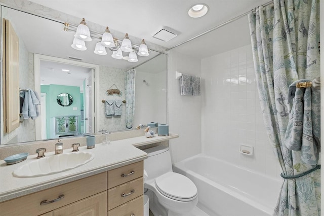 bathroom featuring shower / bath combination with curtain, visible vents, vanity, and toilet