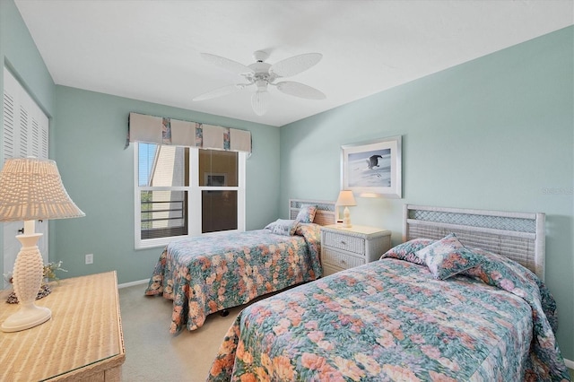 bedroom featuring carpet floors, baseboards, and a ceiling fan