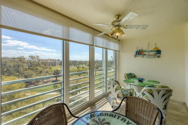 sunroom / solarium with ceiling fan