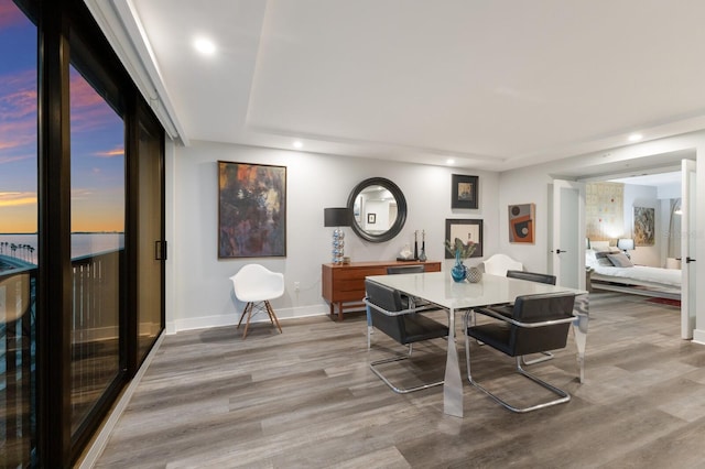 dining room featuring recessed lighting, baseboards, and wood finished floors