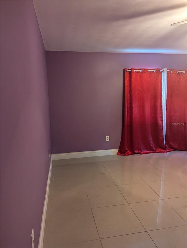 1807 48th Ave W, Bradenton, FL 34207 - tiled empty room featuring baseboards