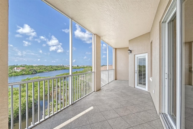 balcony featuring a water view