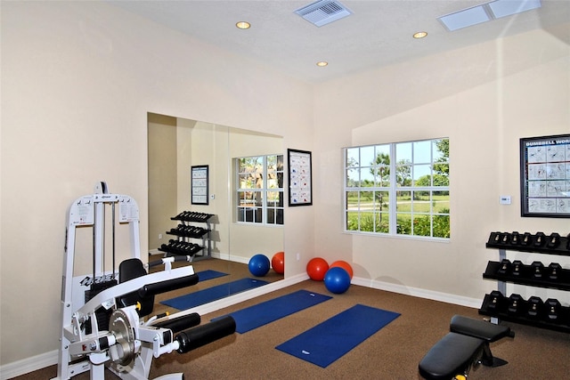 workout area featuring recessed lighting, visible vents, and baseboards