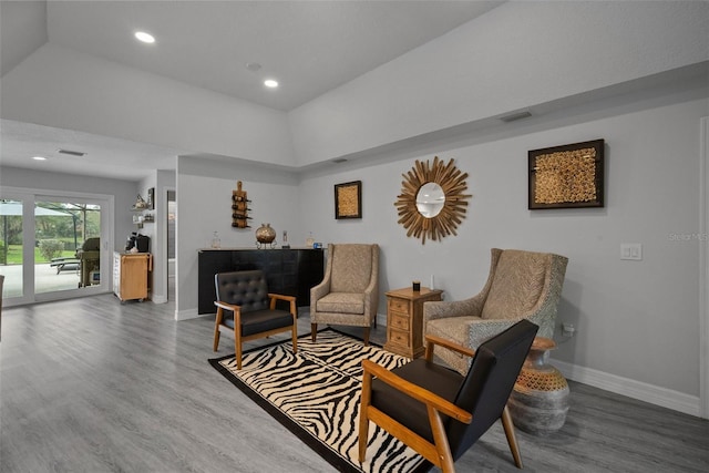 sitting room with recessed lighting, visible vents, baseboards, and wood finished floors