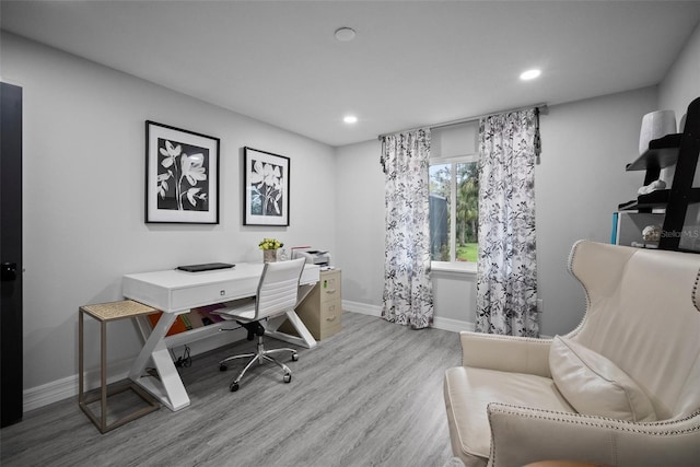 home office featuring recessed lighting, light wood-type flooring, and baseboards