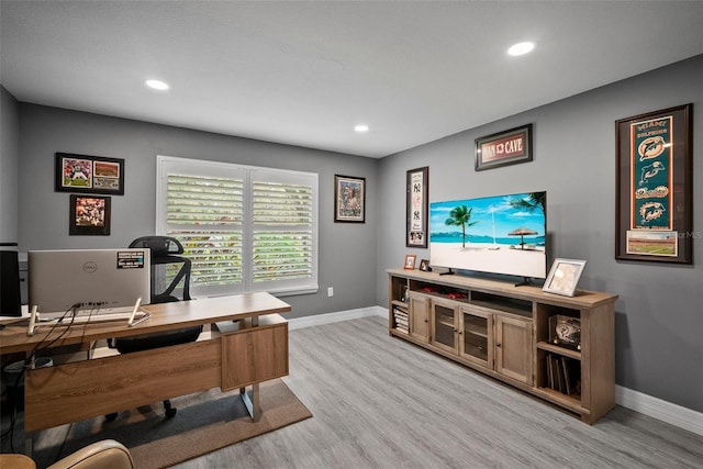 office featuring recessed lighting, light wood-style floors, and baseboards