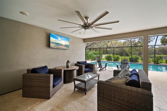 view of patio featuring a lanai, an outdoor pool, an outdoor living space, and ceiling fan