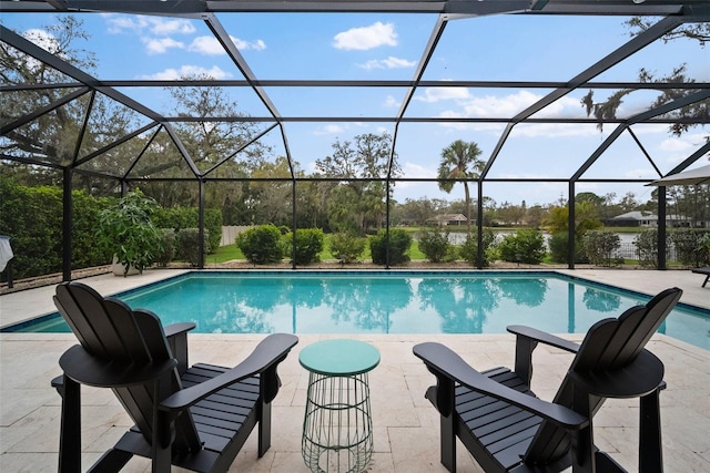 outdoor pool with a patio area