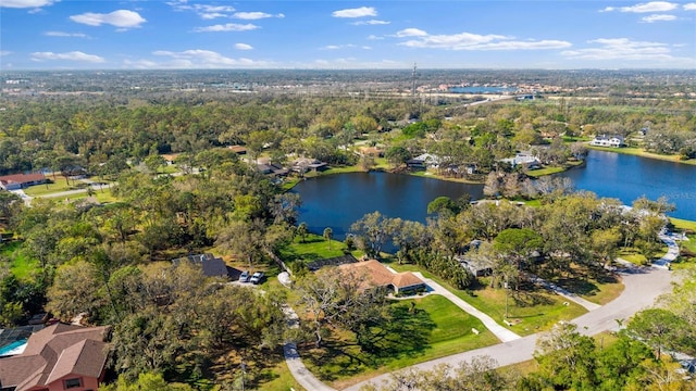 bird's eye view with a wooded view and a water view