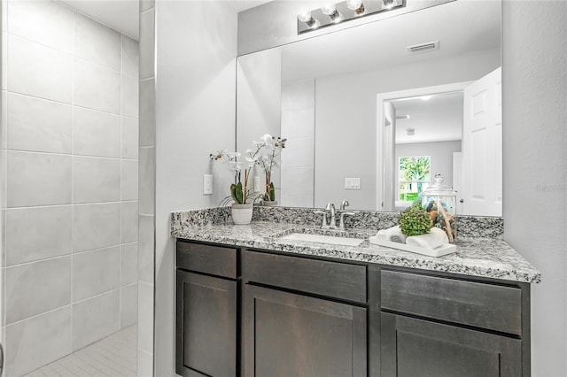 bathroom with visible vents and vanity