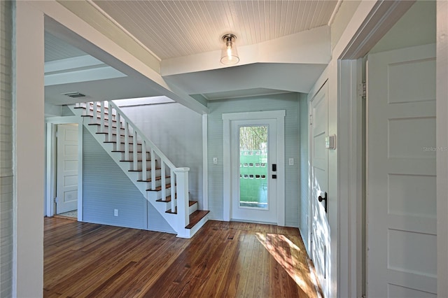 entryway featuring visible vents, stairway, and hardwood / wood-style flooring