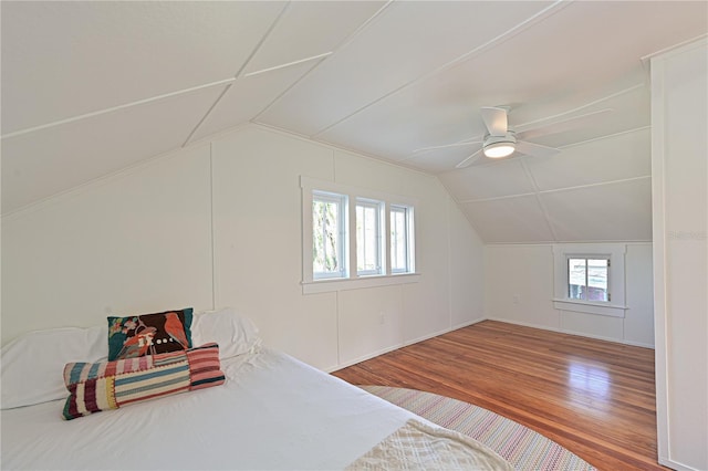 additional living space with vaulted ceiling, ceiling fan, and wood finished floors